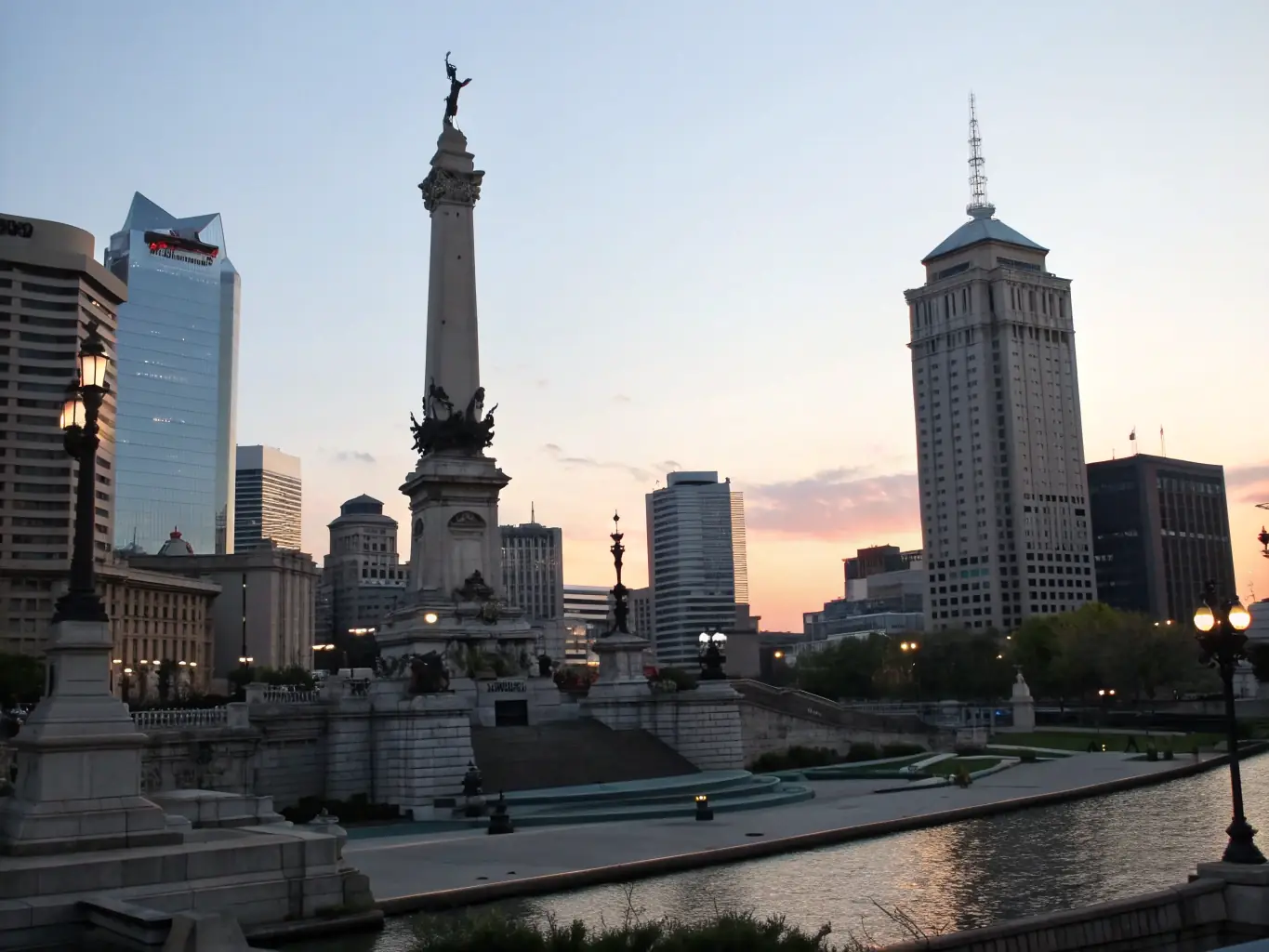 A detailed photograph of the Soldiers and Sailors Monument in downtown Indianapolis, taken on a sunny day, showcasing its intricate architecture and historical significance.